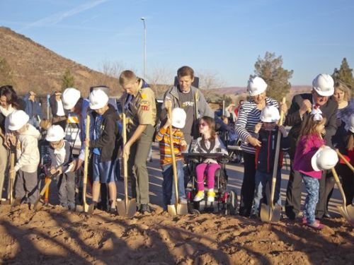 Members of the community, contributors and volunteers gather for the official groundbreaking of the all-abilities park in the Tonaquint Park complex